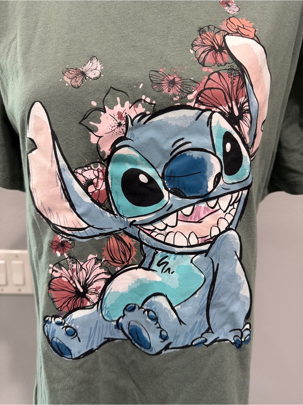 Juniors Stitch Graphic Tee with Pink Floral Accents
